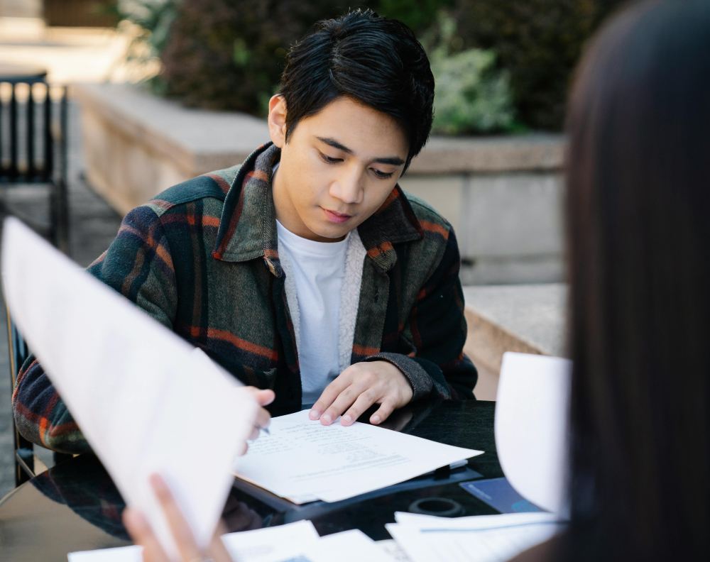 A Student International adviser planning study abroad steps with a family.